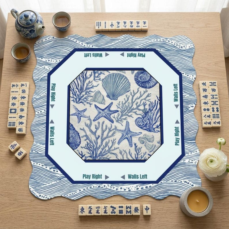 Square and octagonal scalloped mahjong mat for table in blue and white ocean wave print, both showing printed wall direction guides — a mah jongg mat with rules in two shapes. A beautiful mahjong table mat for American mahjong players of all levels.