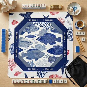 Coastal blue and white mahjong mat with a classic fish and coral design. These stylish mahjong accessories add a beachy, sophisticated touch to your game room decor.