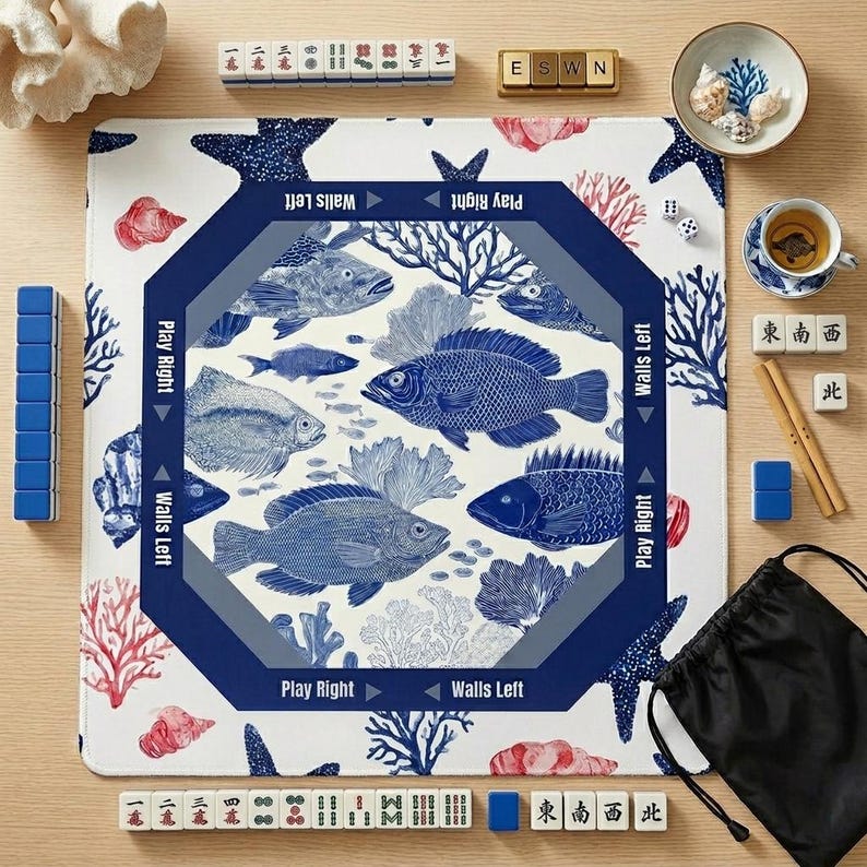 Coastal blue and white mahjong mat with a classic fish and coral design. These stylish mahjong accessories add a beachy, sophisticated touch to your game room decor.