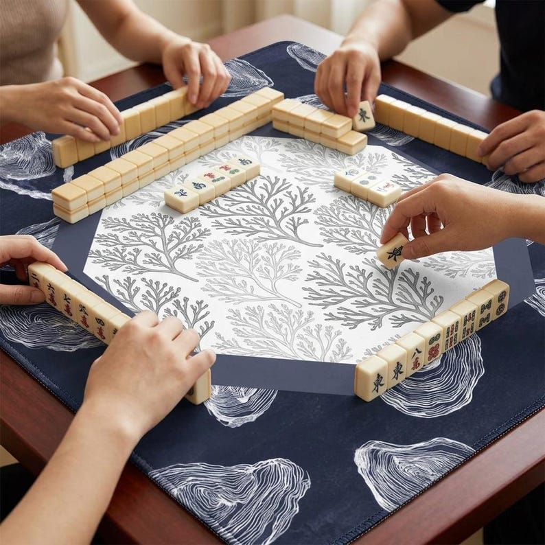 Experience premium quality with this durable mah jongg mat. The smooth fabric surface ensures tiles glide easily, making it a must-have in your collection of mahjong accessories and mah jongg mats for long-term play and table protection.