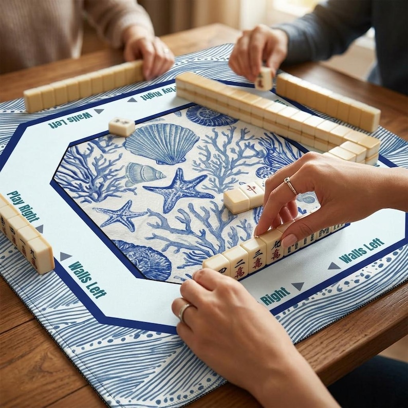 Premium quality mahjong mat with a durable fabric top and non-slip rubber backing. These mah jongg mats protect your table and tiles while providing a professional playing surface with high-definition ocean wave and seashell prints.