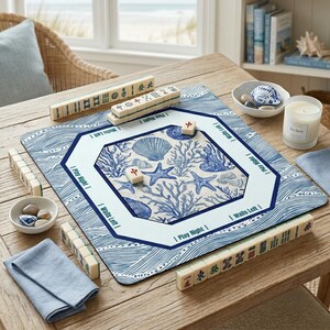 Elegant coastal decor mahjong accessories showcasing a nautical blue and white wave pattern. This aesthetic mahjong mat features beautiful illustrations of starfish and sea coral to complement a beach house or modern home interior.