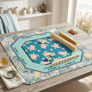 Coastal themed mahjong mat featuring a vibrant sea turtle and pink hibiscus pattern. Perfect for those seeking stylish mahjong accessories that double as beautiful tabletop game decor.