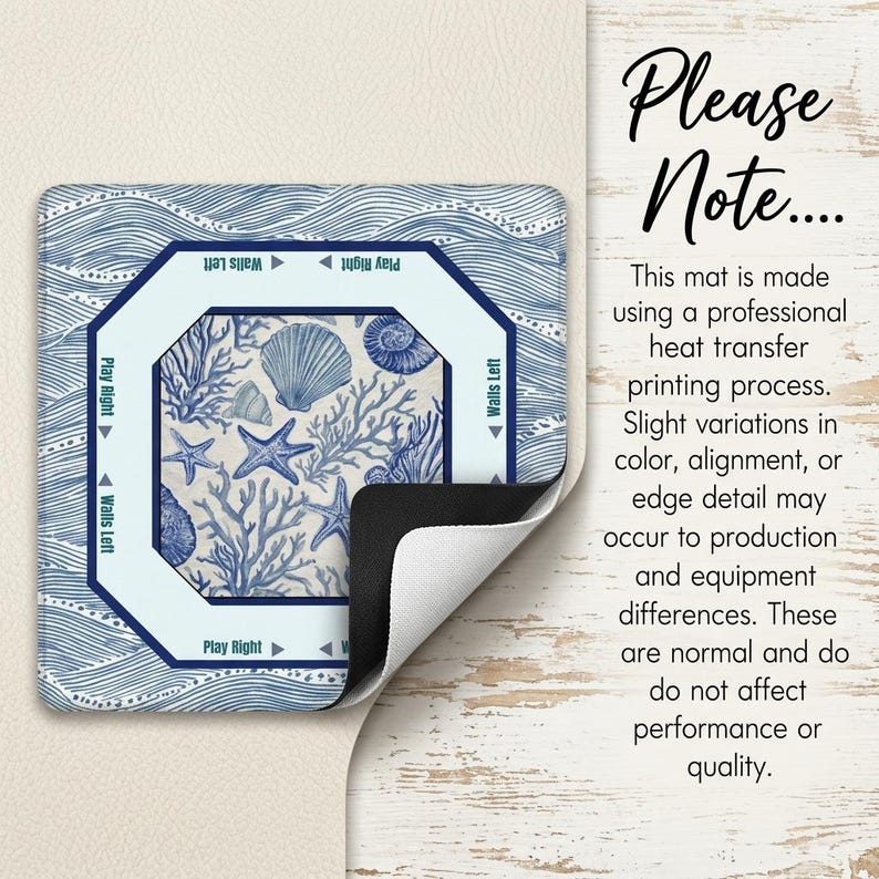 May include: A square mat with a marine-themed design featuring seashells, starfish, and coral in shades of blue and white. The mat has a wave pattern border and the text "Play Right" and "Walls Left".