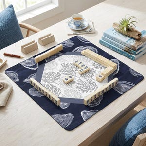 Premium mah jongg mat for tabletop gaming. This high-quality mahjong accessory is among the best mahjong gift ideas, offering a beautiful blue and white oyster print that stands out from standard mahjong mats and enhances every round played.