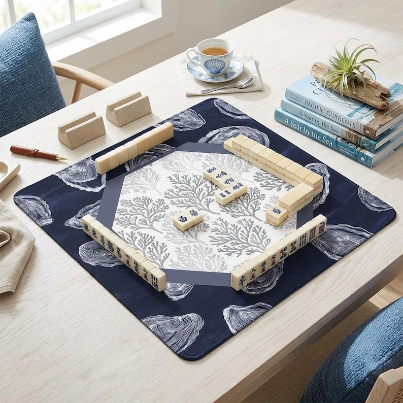 Premium mah jongg mat for tabletop gaming. This high-quality mahjong accessory is among the best mahjong gift ideas, offering a beautiful blue and white oyster print that stands out from standard mahjong mats and enhances every round played.