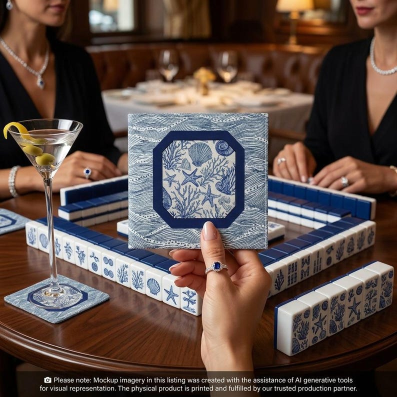 Acrylic mahjong card holder with line finder alongside a blue and white shell-print mahjong card sleeve — a mahjong card cover designed for NMJL American mahjong cards. Part of the fully coordinated blue and white coastal mahjong gift bundle.