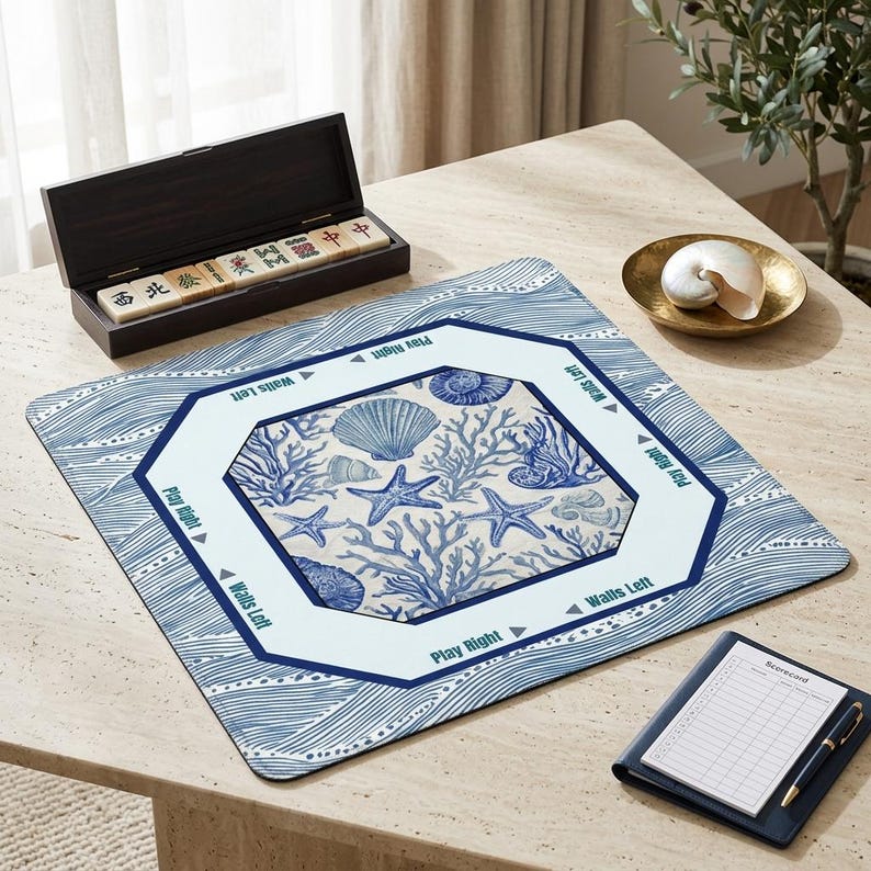 Elegant coastal decor mahjong accessories showcasing a nautical blue and white wave pattern. This aesthetic mahjong mat features beautiful illustrations of starfish and sea coral to complement a beach house or modern home interior.