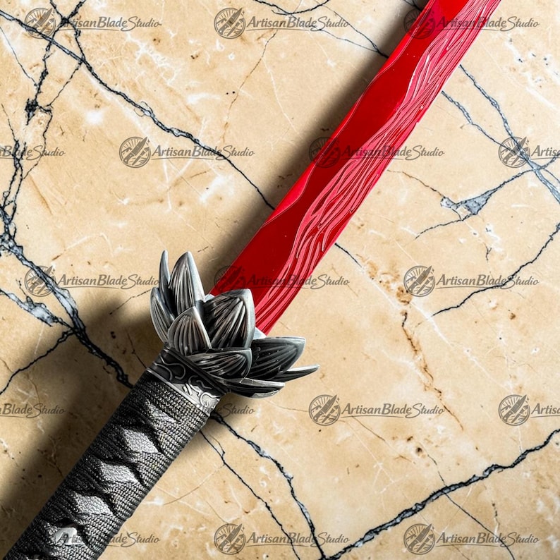 May include: A sword with a vibrant red blade featuring a wavy pattern and a silver-colored metal guard shaped like a lotus flower. The handle is wrapped in a textured black cord, providing a firm grip for the user. The blade is straight and sharp.