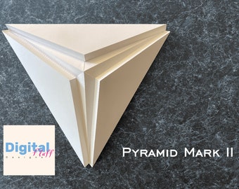 May include: A white pyramid-shaped object made of three layers of cardboard. The object is on a dark gray background with a white text overlay that reads "PYRAMID MARK II".
