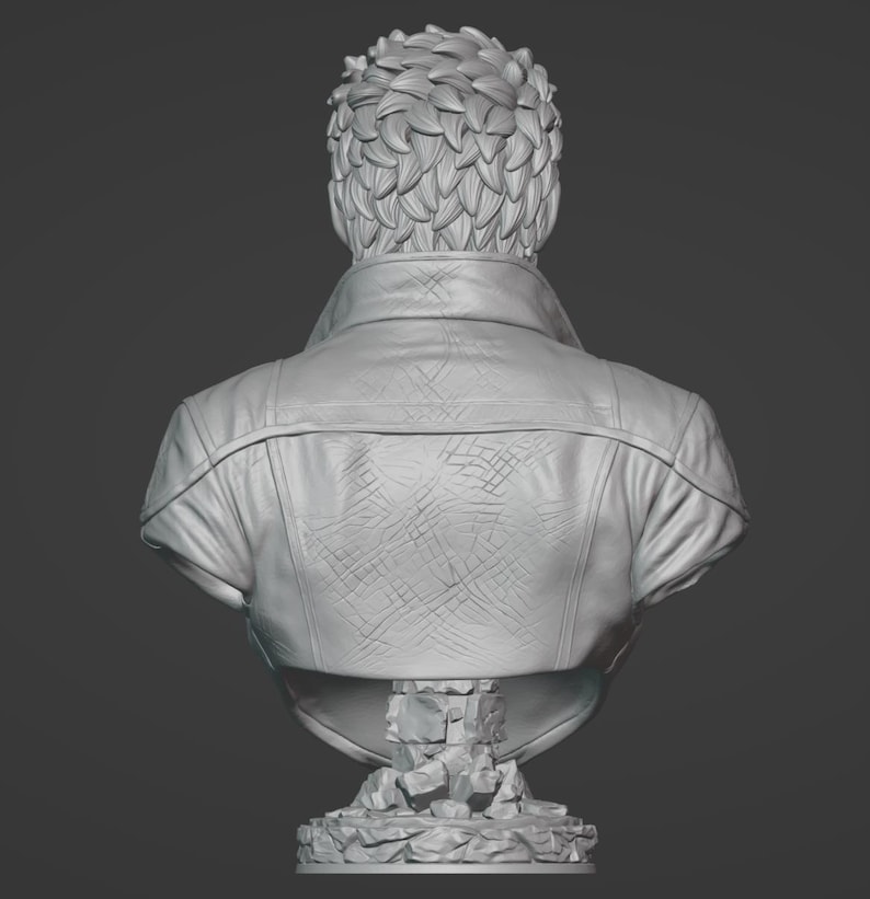 May include: A monochromatic gray bust sculpture of a figure seen from the back. The figure has short, textured hair and wears a jacket with a visible collar and a cross-hatched pattern on the back. The bust rests on a base made of stacked stone.
