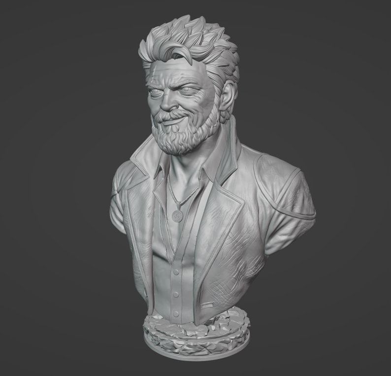 May include: A monochromatic gray bust sculpture of a middle-aged individual with a short, textured hairstyle and a full beard. The figure wears a collared jacket over a button-down shirt with a small circular pendant necklace resting on the chest.