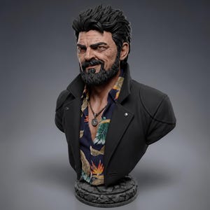 May include: A detailed bust of a bearded character with dark, textured hair, wearing a black jacket over a dark blue shirt featuring a colorful tropical floral print. A silver-toned pendant necklace hangs around the neck, and the figure is mounted on a circular, stone-textured base.