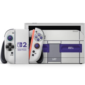 May include: A white Nintendo Switch console and controllers with a retro design. The controllers have purple and orange accents. The console has the text "Nintendo Switch" and "EJECT" and "RESET" buttons.