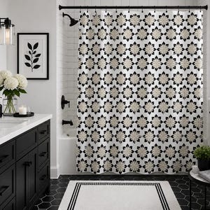 May include: A shower curtain featuring a repeating geometric star pattern in black, white, and beige. The fabric hangs from a black rod and displays a symmetrical, multi-pointed floral-like motif across the entire surface of the curtain.