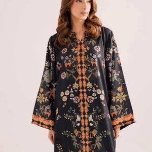 May include: Black tunic with a V-neck and long sleeves. The tunic features a floral pattern in shades of orange, green, and white. The floral design is symmetrical and covers the front and sleeves of the tunic. The tunic is made of a soft, flowing fabric.