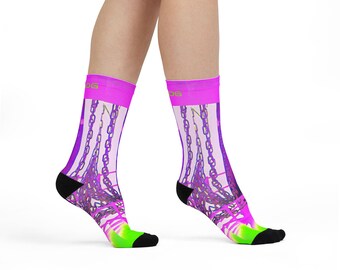 May include: A pair of sheer socks with a vibrant design. The socks feature a neon pink cuff, black heel and toe, and a neon green sole. The main design is a purple chain pattern against a light pink background. The socks are worn on a person's legs.
