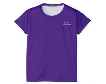 May include: A short-sleeved, purple t-shirt with a white crew neck. The shirt features the white text "VEREDG" above a mountain graphic on the upper left chest. The shirt is made of a lightweight, breathable fabric.