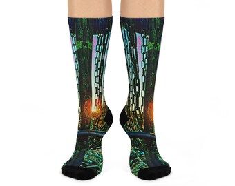 May include: A pair of knee-high socks featuring a surreal image of chains and a sunset. The socks have a black toe and heel, with the main design in shades of green, blue, and orange. The design is printed on a white background.