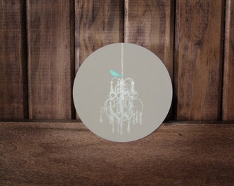 PRETTY classy BIRD-An Illustration of a teal bird perched upon a white chandelier Infused onto a high gloss metal circle