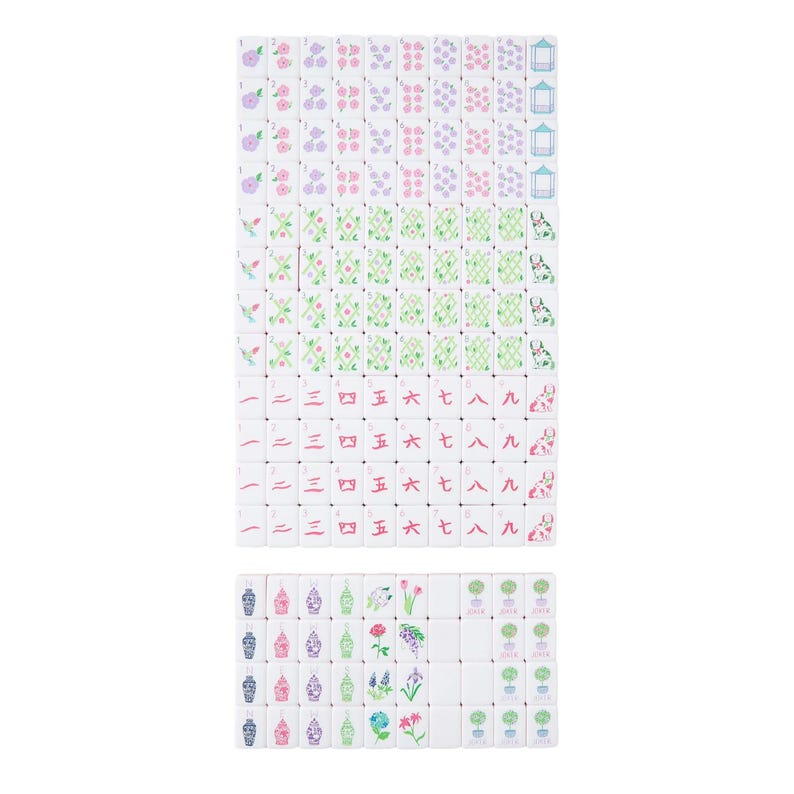 May include: A collection of white Mahjong tiles, arranged in a rectangular pattern. The tiles feature various floral and geometric designs in pink, purple, and green. Some tiles display Chinese numerals. The overall aesthetic is clean and organized.