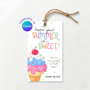 May include: A rectangular white gift tag with a brown twine loop featuring a colourful illustration of an ice cream cone with blue and pink scoops, a cherry on top, and sprinkles. Text reads: hope your SUMMER is SWEET! here's to sunny days and sweet treats! FROM OLIVIA.