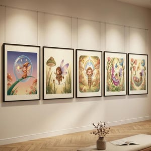 May include: Five framed wall art prints displayed in a row, each featuring a colourful illustration of a small fairy character in a natural setting with mushrooms, flowers, and plants, all enclosed in thin black frames hanging from a wire system.