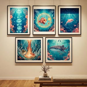 May include: A gallery wall arrangement featuring five framed prints of underwater scenes. The artwork depicts various marine life including jellyfish, an anglerfish, a dolphin, and a whale shark, all rendered in vibrant blue and coral color palettes.