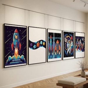 May include: Five framed rectangular wall art prints featuring space-themed illustrations. The prints display colorful rockets, planets, and an astronaut bear character against dark starry backgrounds and white negative space, all hung in a row.