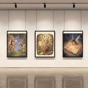 May include: Five framed art prints depicting whimsical fairy scenes. Each piece features colorful illustrations of fairies in various settings, including forests and mushroom houses. The artwork is displayed in a gallery setting with track lighting.