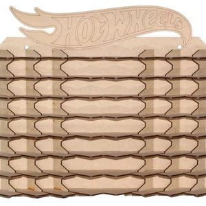 May include: A wooden display shelf for Hot Wheels cars. The shelf has multiple tiers and a cutout of the Hot Wheels logo at the top. The display is made of light brown wood and is designed to hold many toy cars.