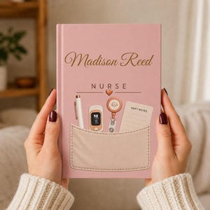 May include: A dusty pink hardcover notebook featuring the name Madison Reed and the word NURSE in gold script. A graphic of a pocket contains a white pen, a pulse oximeter, a badge reel with a heart icon, and a notepad labeled SHIFT NOTES.