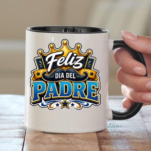 May include: White ceramic mug with a black handle and rim. The mug features the text "Feliz Dia Del Padre" in blue and gold, with a crown and mustache design. A perfect gift for Father's Day.