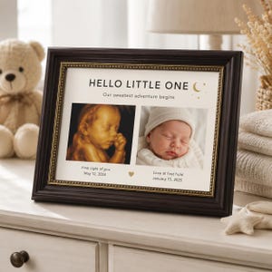 May include: A dark brown wooden picture frame with a gold inner border containing a print titled HELLO LITTLE ONE. It features two photos: an ultrasound scan dated May 12, 2024, and a newborn baby in a white hat dated January 15, 2025.