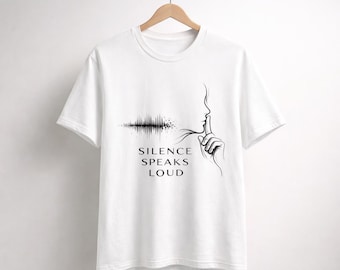 Camiseta con la frase "El silencio habla más fuerte" / Camiseta con diseño de onda sonora y perfil de silencio.