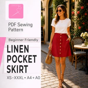 Op de afbeelding: Rode linnen rok met zakken en houten knopen, gecombineerd met een witte t-shirt. De rok maakt deel uit van een PDF naaipatroon, geschikt voor beginners, en verkrijgbaar in maten XS-XXXL. De afbeelding toont ook een strooien handtas en sandalen.