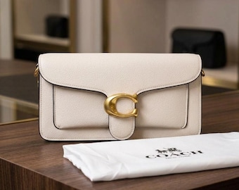 Nwot coach shoulder bag in a white/off-white color