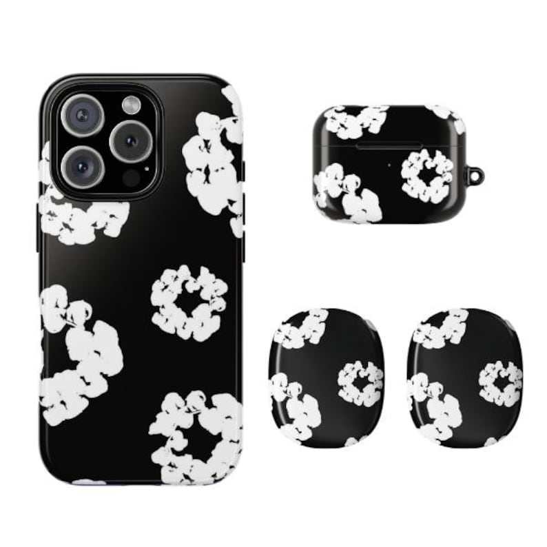 May include: A black phone case, AirPod case, and two phone grips with a white floral pattern. The phone case has a camera cutout. The AirPod case has a small loop. The phone grips are round.