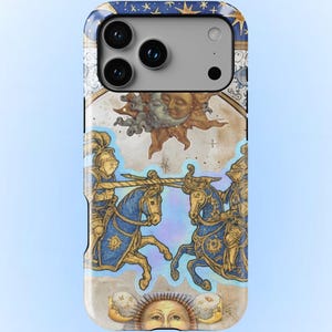 May include: A smartphone case featuring a detailed illustration of two knights in gold armor riding blue horses, engaged in a joust. The design includes celestial motifs with a sun and moon face, set against a parchment-colored background with stars.