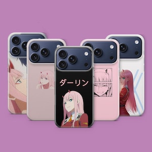 May include: A selection of phone cases with anime-style character illustrations. The cases showcase a female character with pink hair and horns. One case has the Japanese word "Darling" printed on it. The cases are in shades of pink and black.