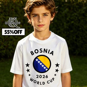May include: A white t-shirt featuring the word "BOSNIA" above a circular graphic of the Bosnian flag and the text "2026 WORLD CUP". The shirt also has black star accents. The image includes the text "55% OFF" in a black box.