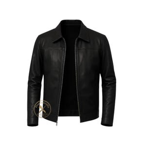 May include: A black leather jacket featuring a classic collar, long sleeves with cuffs, and a full-length front zipper closure. A circular logo with the text PLeathercrafts and a crossed tool icon is visible on the lower left side of the jacket.