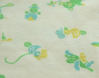 green, blue and yellow novelty juvenile print vintage cotton knit fabric -- 16 wide by 7/8 yard