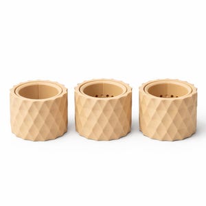 May include: A set of three ceramic mugs with a speckled, matte finish. The mugs are in shades of blue, green, and white. Each mug has a simple, modern design, perfect for coffee or tea.