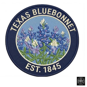 May include: A circular embroidered patch featuring a light blue background with a cluster of blue and white Texas bluebonnet flowers. The dark blue border contains the text TEXAS BLUEBONNET at the top and EST. 1845 at the bottom in cream.