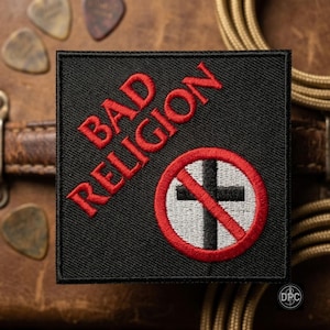 May include: A square black embroidered patch featuring the red text BAD RELIGION arranged diagonally. Below the text is a circular emblem with a red border, a white background, a black cross, and a red diagonal slash crossing through the center.