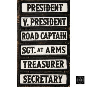 May include: A set of six rectangular embroidered patches with white backgrounds and black borders. Each patch features black text reading PRESIDENT, V. PRESIDENT, ROAD CAPTAIN, SGT. AT ARMS, TREASURER, and SECRETARY in a bold, serif font style.