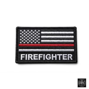 May include: A rectangular embroidered patch featuring a stylized American flag design with black and white stripes, a single horizontal red stripe, and white stars on a black field. The word FIREFIGHTER is stitched in white capital letters.
