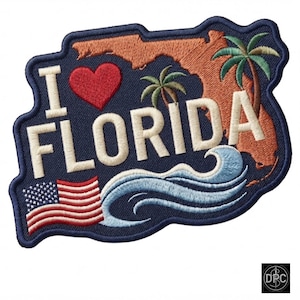 May include: An embroidered patch with a dark blue background featuring the text I LOVE FLORIDA in white, a red heart, an orange outline of the state of Florida, two green palm trees, a blue ocean wave, and a small American flag in the corner.