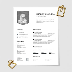 May include: A resume template with a headshot, contact information, and work experience details. The document includes sections for education and references. Gold paper clips are in the top right and bottom left corners.